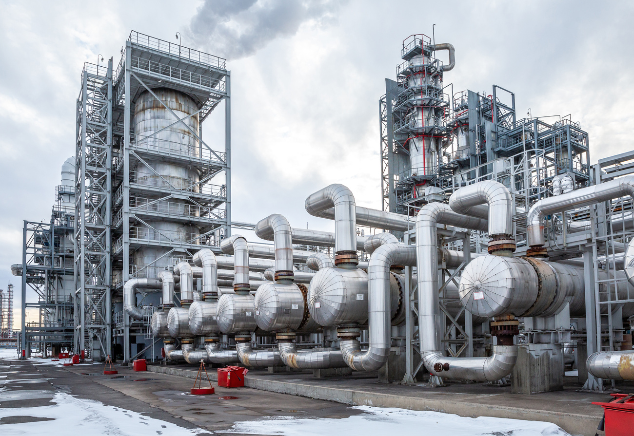 Heat exchanger integrated into an industrial process piping system