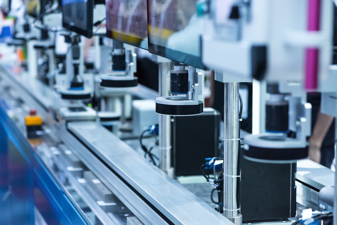 Automated industrial production line equipped with multiple machine vision cameras for inspection, monitoring, and quality control.
