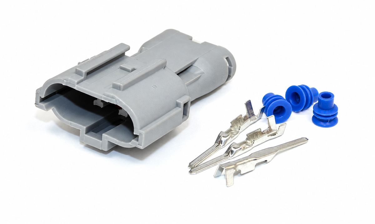 Disassembled sealed electrical connector showing the housing, terminals, wire seals, cavity plugs, and related components.